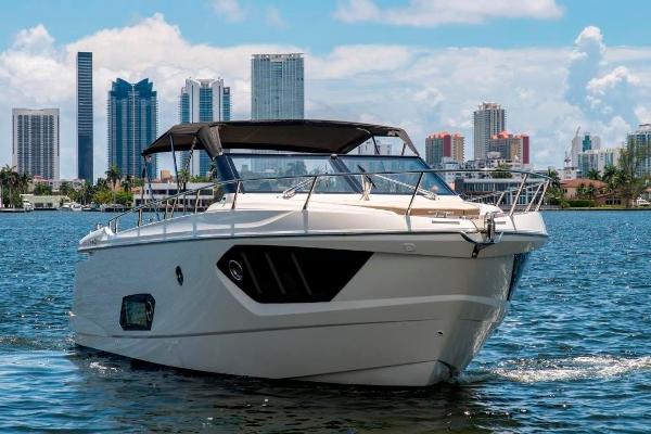 Slide: The Image of 2015 Absolute 40 STL yacht cruising in urban waters with city skyline. - 1