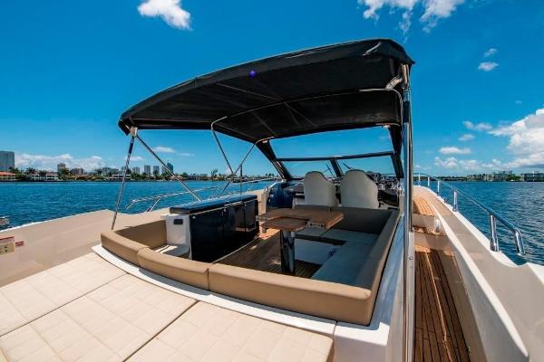 Slide: The Image of 2015 Absolute 40 STL yacht with spacious deck and canopy on a sunny day. - 11