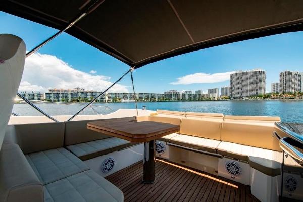 Slide: The Image of Luxurious seating area on 2015 Absolute 40 STL yacht with city skyline view. - 12