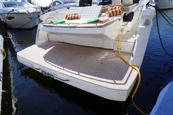 Slide: The Image of 2015 Absolute 40 STL yacht with spacious swim platform and cushioned seating. - 13
