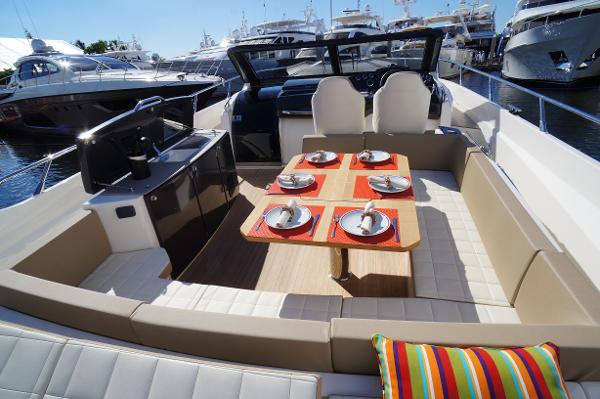 Slide: The Image of 2015 Absolute 40 STL yacht with elegant dining setup on deck. - 14