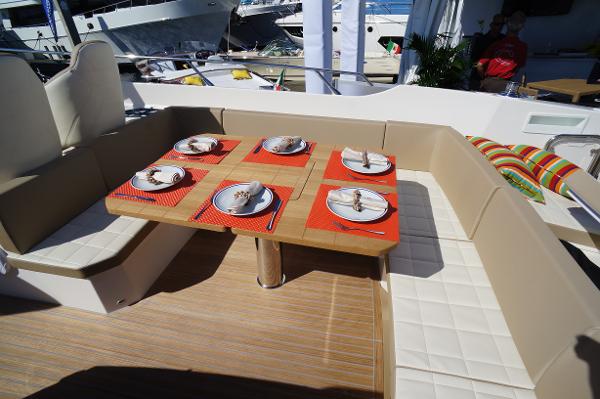 Slide: The Image of Outdoor dining area on a 2015 Absolute 40 STL yacht, set for six. - 17
