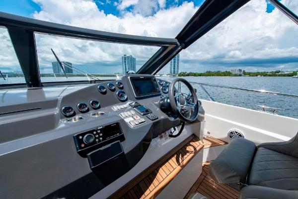 Slide: The Image of Helm of 2015 Absolute 40 STL yacht with modern controls and waterfront view. - 20