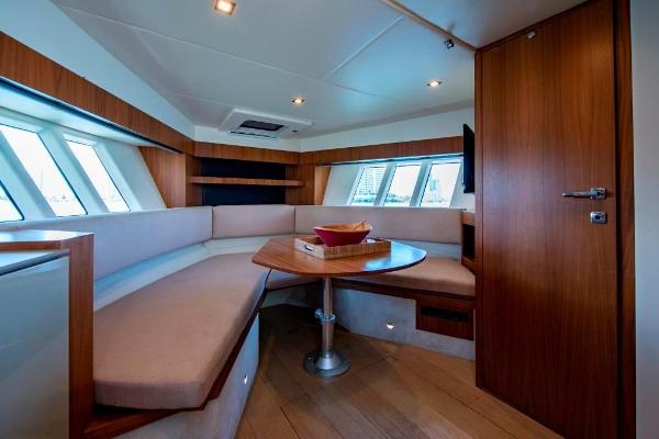 Slide: The Image of Luxurious interior of 2015 Absolute 40 STL yacht with cozy seating and wooden finishes. - 23