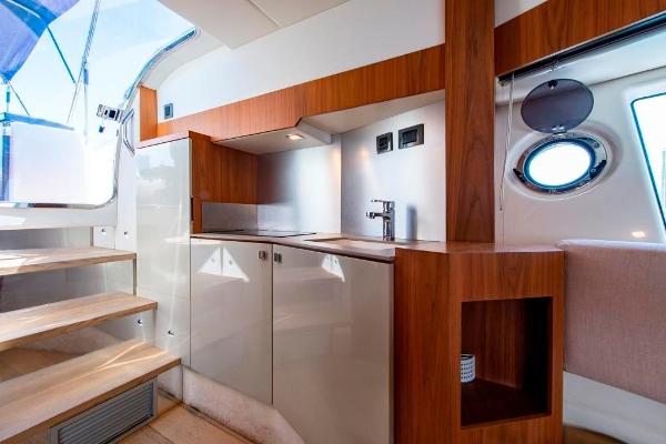 Slide: The Image of Modern kitchen area in 2015 Absolute 40 STL yacht with wooden cabinetry and stainless steel sink. - 26
