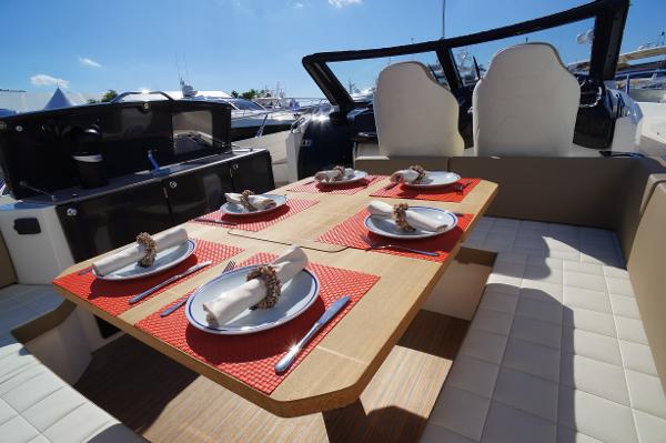 Slide: The Image of Dining area on 2015 Absolute 40 STL yacht with table set for six. - 31