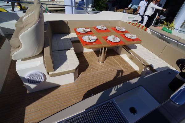 Slide: The Image of 2015 Absolute 40 STL yacht dining area with table set for four. - 33
