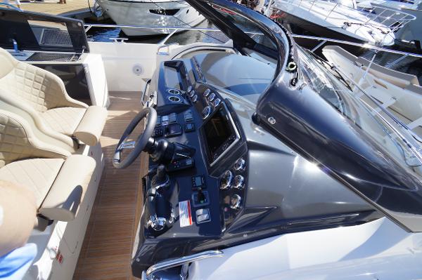 Slide: The Image of Cockpit of a 2015 Absolute 40 STL yacht with modern controls and beige seating. - 36