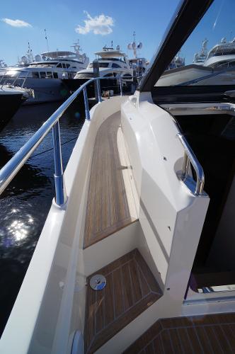 Slide: The Image of 2015 Absolute 40 STL yacht walkway with wooden deck and stainless steel railings. - 37