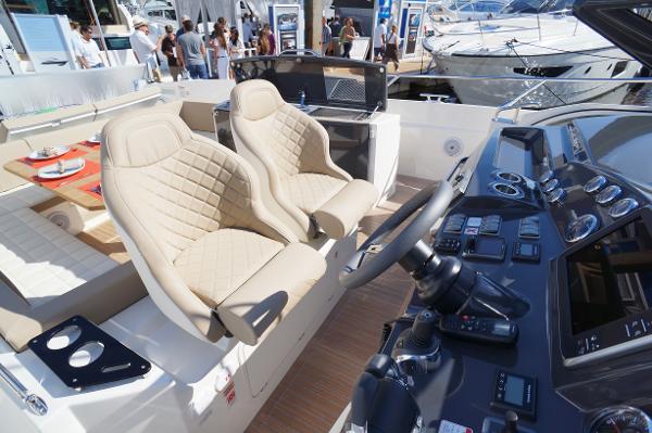 Slide: The Image of Luxury interior of 2015 Absolute 40 STL yacht with beige seats and modern dashboard. - 38