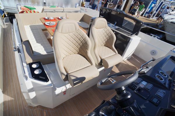 Slide: The Image of Luxury interior of 2015 Absolute 40 STL yacht with beige seating and modern controls. - 39