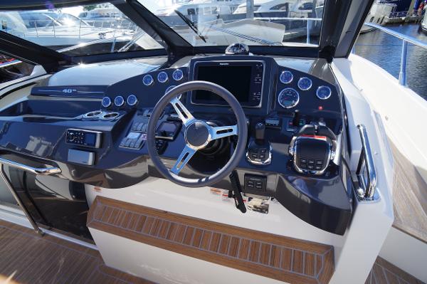 Slide: The Image of Cockpit of 2015 Absolute 40 STL yacht with modern navigation controls and steering wheel. - 43