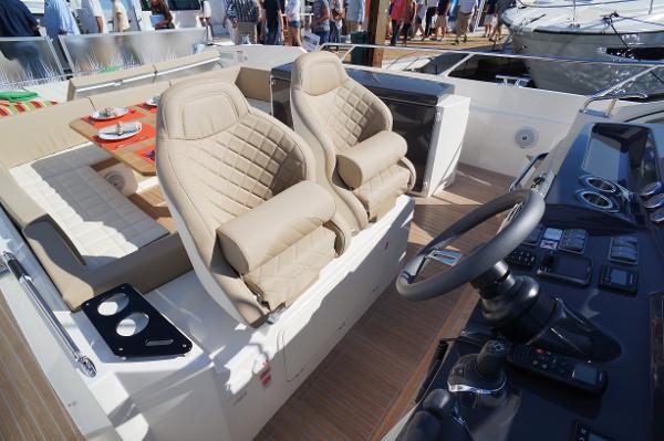 Slide: The Image of Interior of 2015 Absolute 40 STL yacht with beige leather seats and modern dashboard. - 45