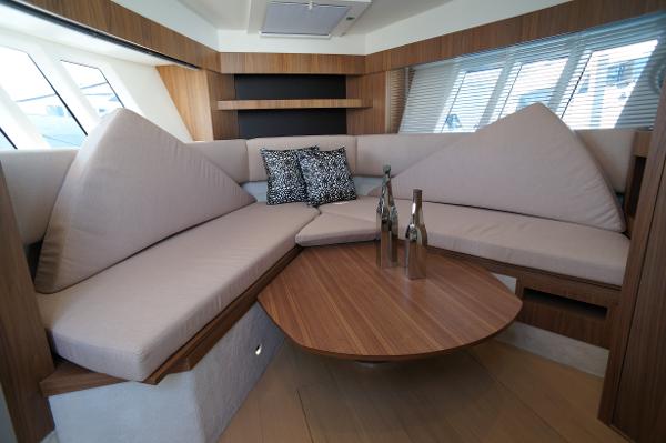 Slide: The Image of Luxurious interior of 2015 Absolute 40 STL yacht with modern seating and wooden table. - 46