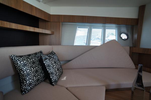 Slide: The Image of Interior of 2015 Absolute 40 STL yacht with modern beige sofa and patterned cushions. - 47