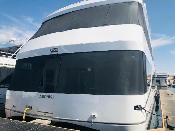 Slide: The Image of Luxury yacht Adonia Adonis Trip 3, 2018 model, docked under clear skies. - 0