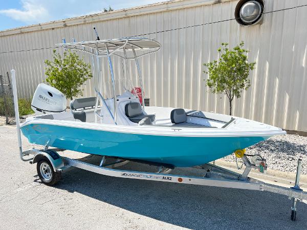 Slide: The Image of 2024 ALK2 Powerboats 18 CRS on trailer, blue hull, Suzuki outboard motor. - 0