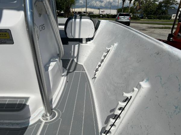 Slide: The Image of 2024 ALK2 Powerboats 18 CRS interior view, showcasing rod holders and sleek design. - 18