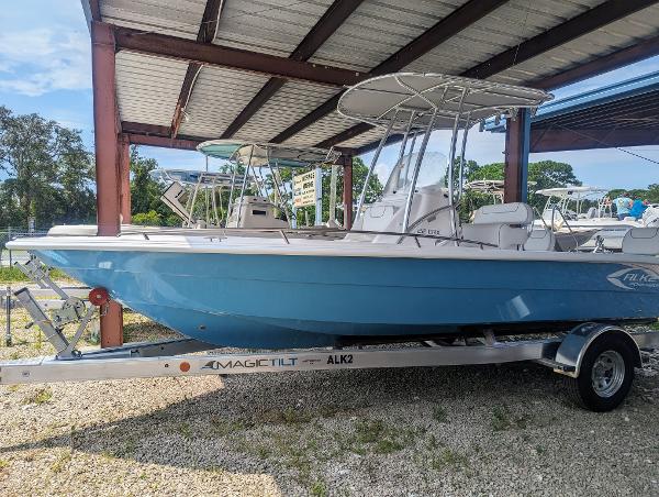 Slide: The Image of 2024 ALK2 Powerboats 22 CRX in blue on trailer under shelter. - 2