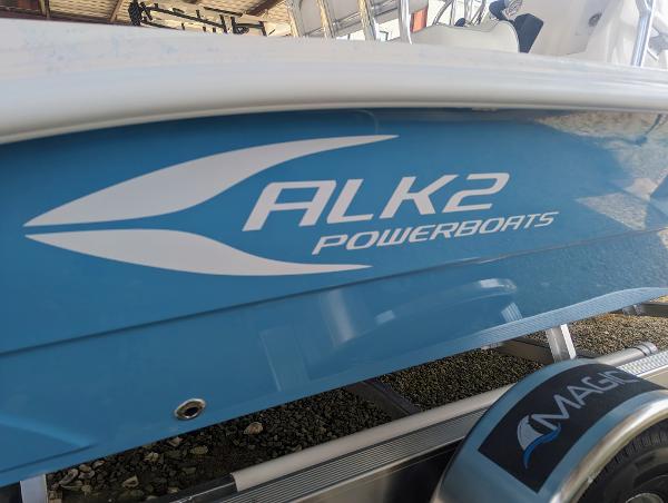 Slide: The Image of 2024 ALK2 Powerboats 22 CRX, blue hull with logo, on trailer. - 3