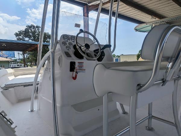 Slide: The Image of 2024 ALK2 Powerboats 22 CRX interior with steering console and seating. - 6