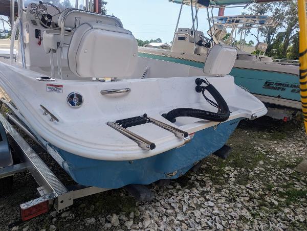 Slide: The Image of 2024 ALK2 Powerboats 22 CRX on trailer, rear view, white and blue hull. - 8