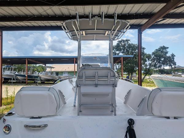 Slide: The Image of 2024 ALK2 Powerboats 22 CRX under shelter, showcasing sleek design and spacious seating. - 9