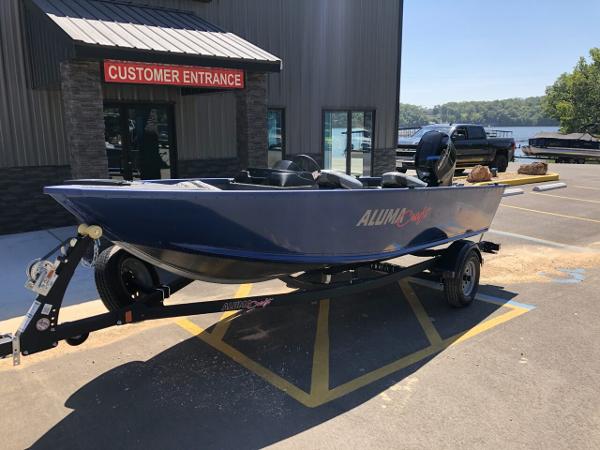 Slide: The Image of 2024 Alumacraft 165 Escape CS boat on trailer outside dealership. - 2