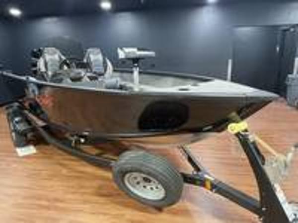 Slide: The Image of 2023 Alumacraft Escape 165 CS fishing boat on trailer in showroom. - 3
