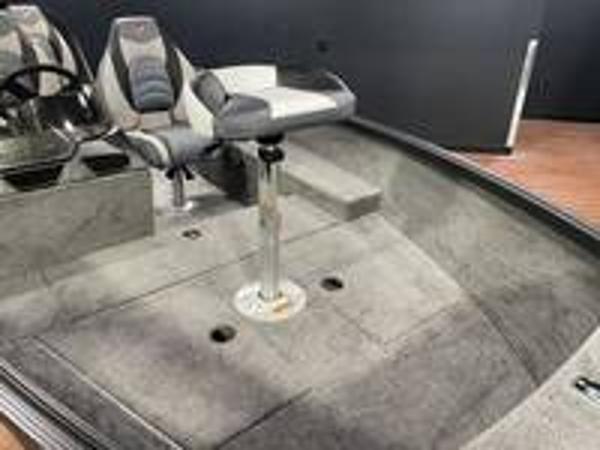 Slide: The Image of 2023 Alumacraft Escape 165 CS boat interior with seating and steering wheel. - 6