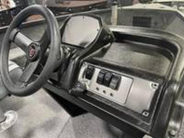 Slide: The Image of 2023 Alumacraft Escape 165 CS boat dashboard and steering wheel. - 7