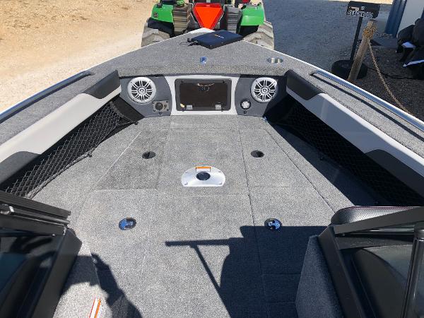 Slide: The Image of 2024 Alumacraft Trophy 195 boat interior with speakers and storage compartments. - 12