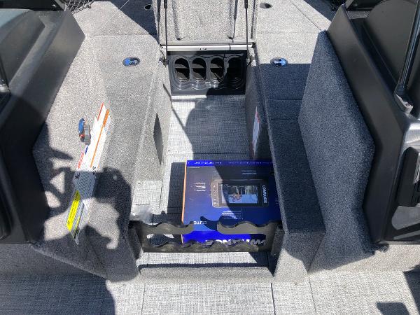 Slide: The Image of 2024 Alumacraft Trophy 195 boat interior with storage compartments and cup holders. - 13