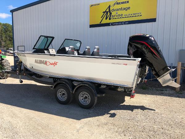 Slide: The Image of 2024 Alumacraft Trophy 195 boat on a trailer outside Advantage Marine. - 5
