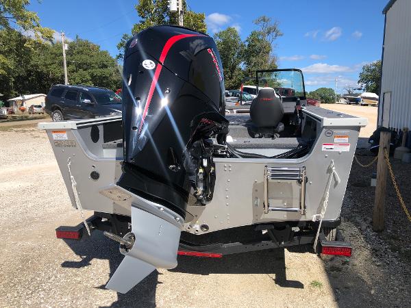 Slide: The Image of 2024 Alumacraft Trophy 195 boat with outboard motor, rear view. - 7
