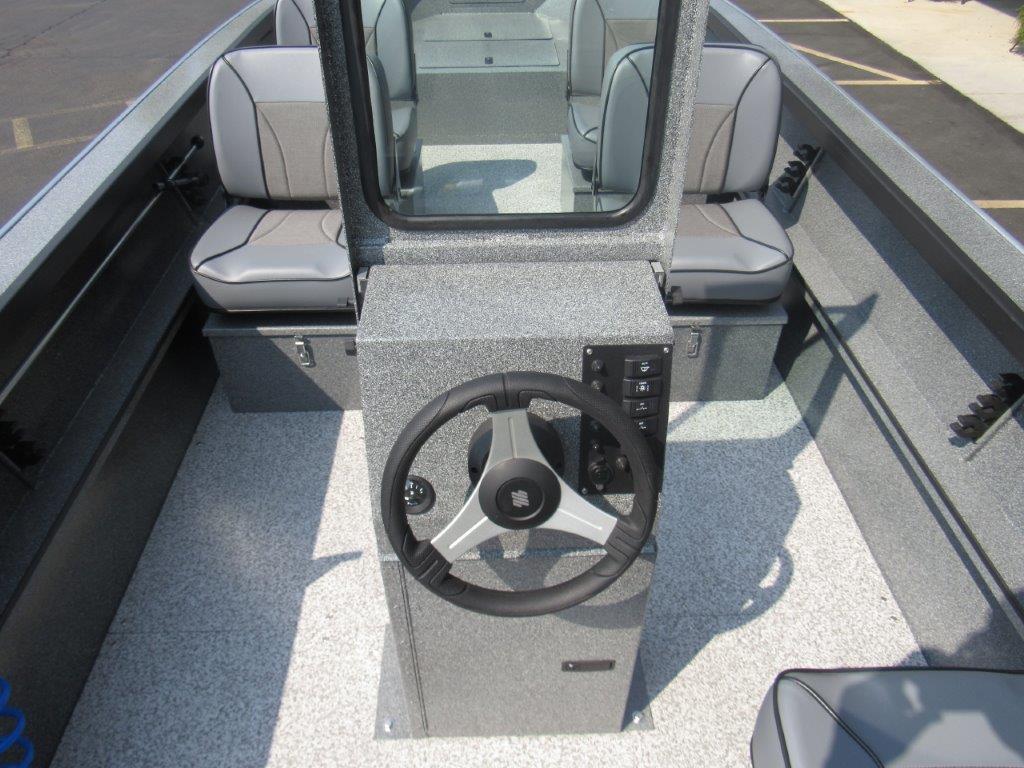 Slide: The Image of 2024 Alumaweld 20 Adventurer boat interior with steering console and seating. - 11