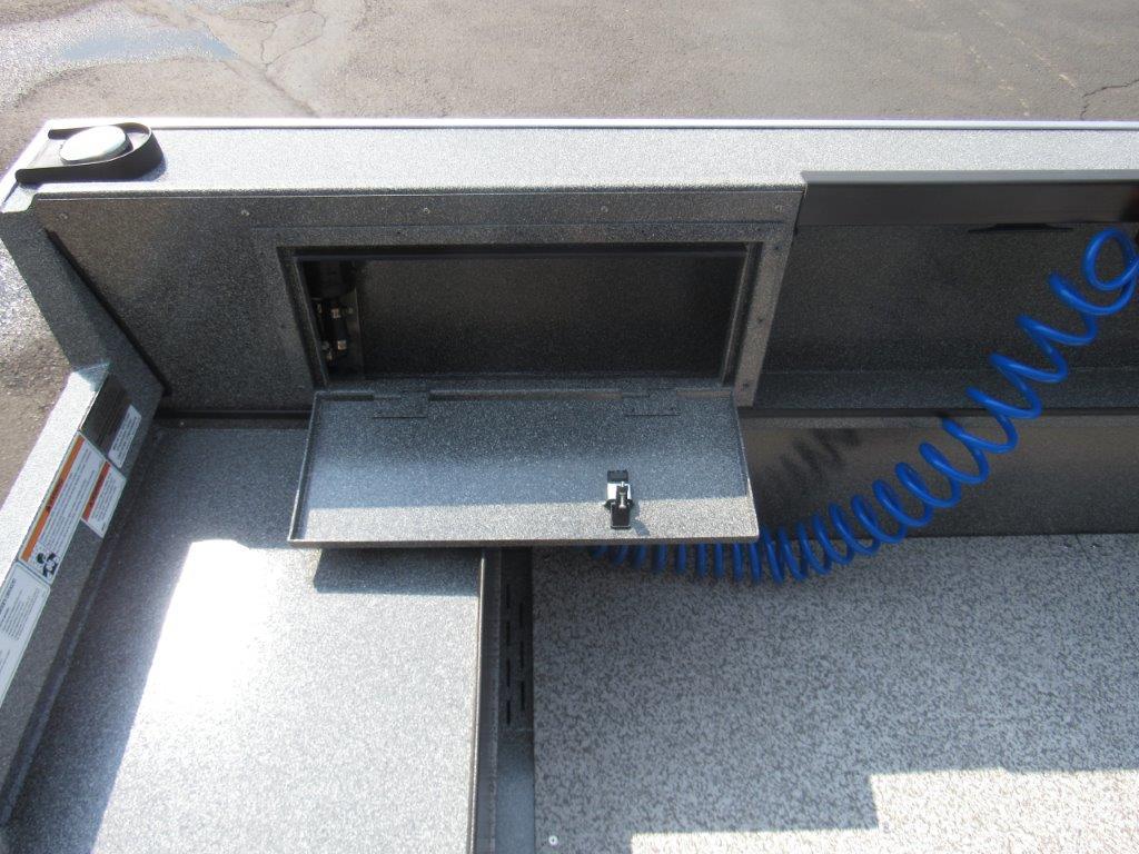 Slide: The Image of 2024 Alumaweld 20 ADVENTURER boat storage compartment with blue coiled hose. - 15