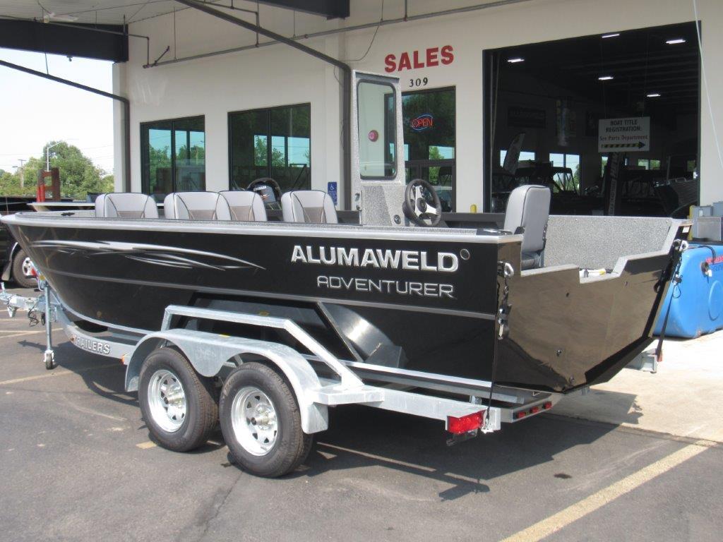 Slide: The Image of 2024 Alumaweld 20 Adventurer boat on a trailer outside a sales showroom. - 3