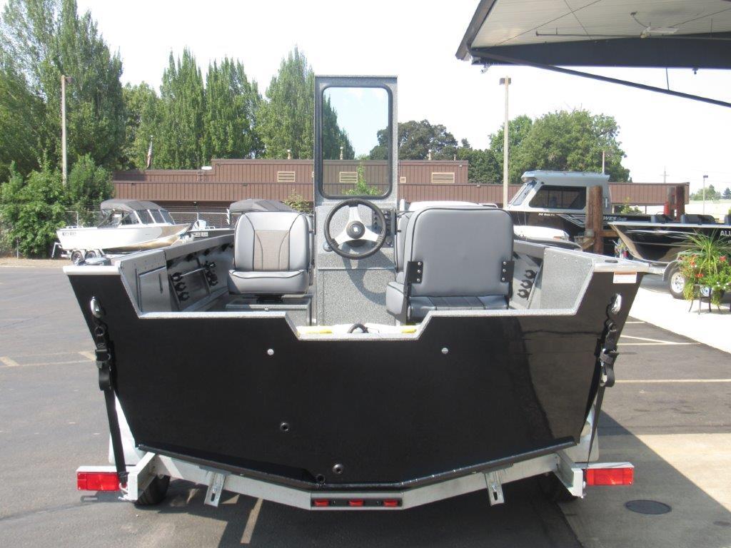 Slide: The Image of 2024 Alumaweld 20 Adventurer boat, rear view, parked on a trailer. - 4