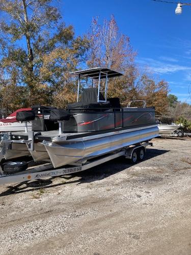Slide: The Image of 2023 Angler Qwest PRO FISH N CRUISE 8522/24 pontoon boat on trailer. - 2