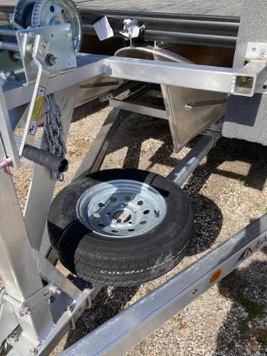 Slide: The Image of 2023 Angler Qwest PRO FISH N CRUISE 8522/24 trailer with spare tire. - 8
