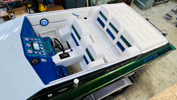 Slide: The Image of 1991 Apache POKER RUN CUSTOM boat interior with white and blue seating. - 14
