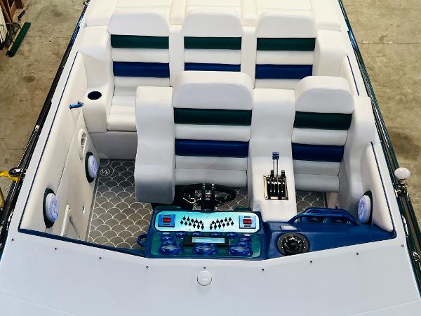 Slide: The Image of 1991 Apache Poker Run Custom boat interior with white and blue seating. - 21