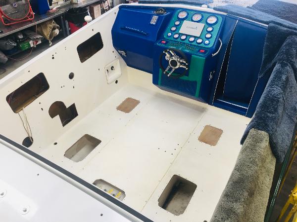 Slide: The Image of 1991 Apache POKER RUN CUSTOM boat interior under renovation, showing dashboard and seating area. - 24