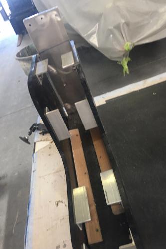 Slide: The Image of 1991 Apache POKER RUN CUSTOM boat part in a workshop. - 38