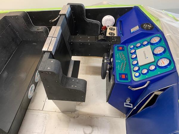 Slide: The Image of 1991 Apache POKER RUN CUSTOM boat cockpit with blue dashboard and control panel. - 45