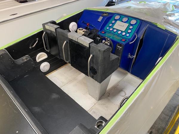 Slide: The Image of 1991 Apache POKER RUN CUSTOM boat cockpit with blue dashboard and dual seats. - 47