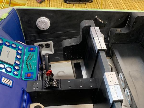 Slide: The Image of 1991 Apache POKER RUN CUSTOM boat cockpit with control panel and seating. - 48
