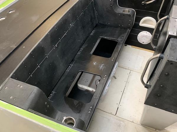 Slide: The Image of 1991 Apache POKER RUN CUSTOM boat interior with storage compartments. - 49