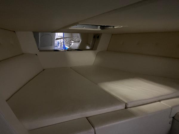 Slide: The Image of Interior cabin of a 1991 Apache Poker Run Custom boat with beige upholstery. - 9